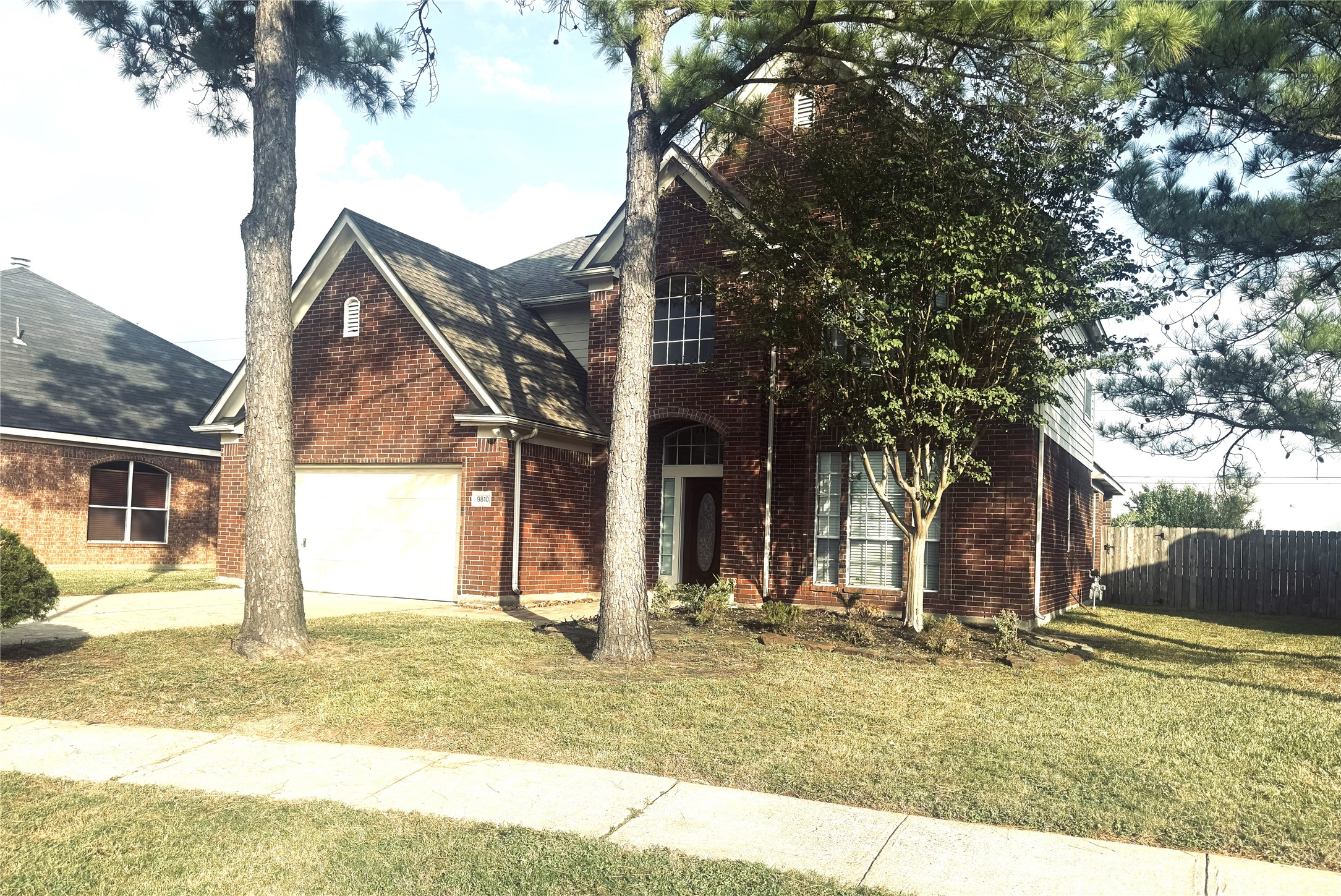 9810 Mossy Tree Lane Houston, TX 77064 - Photo 3 of 24 a view of a house with snow on the tree