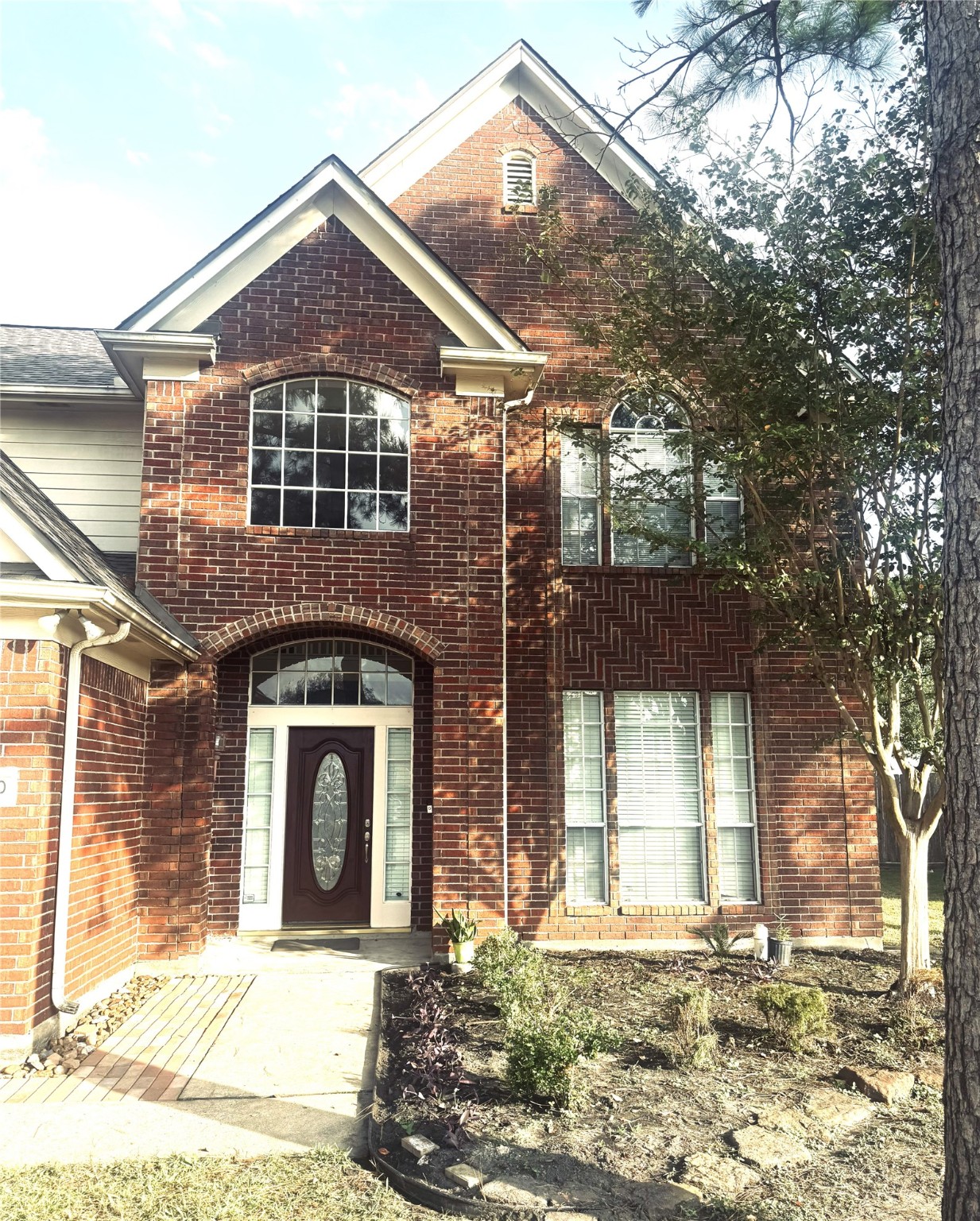 9810 Mossy Tree Lane Houston, TX 77064 - Photo 4 of 24 a front view of a house with a yard
