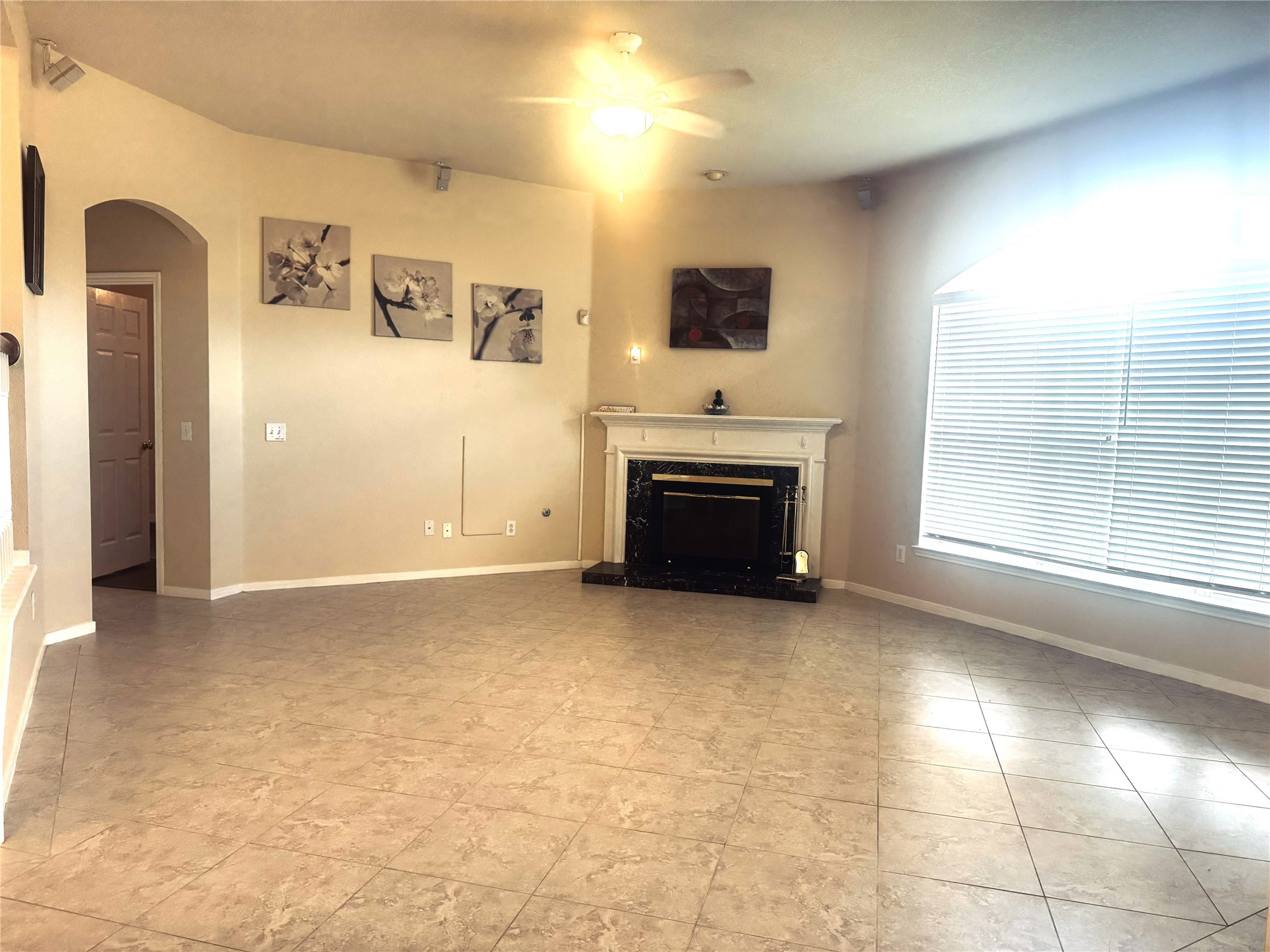 9810 Mossy Tree Lane Houston, TX 77064 - Photo 6 of 24 a view of empty room with a fireplace