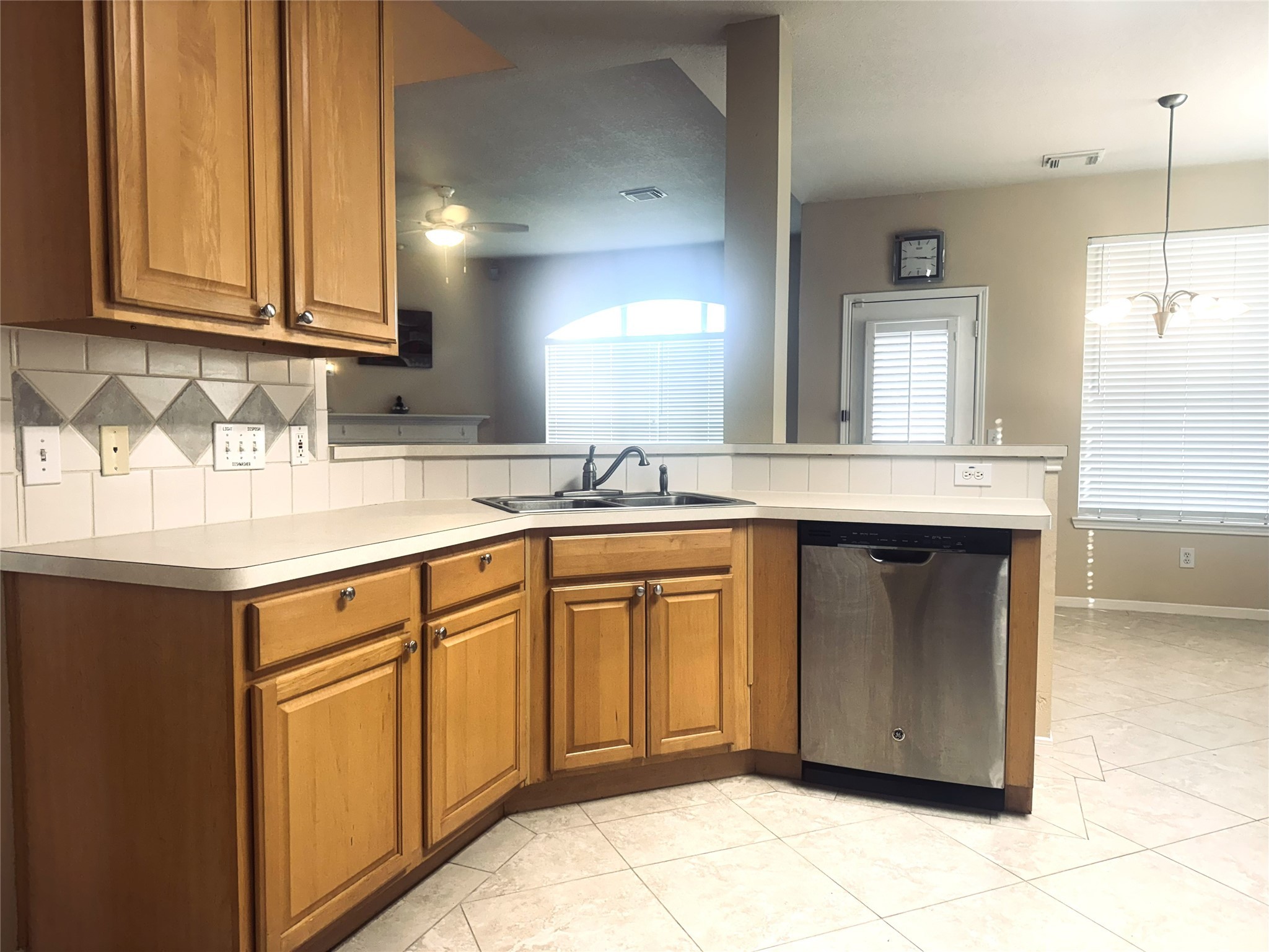 9810 Mossy Tree Lane Houston, TX 77064 - Photo 7 of 24 a kitchen with stainless steel appliances granite countertop a sink stove and cabinets