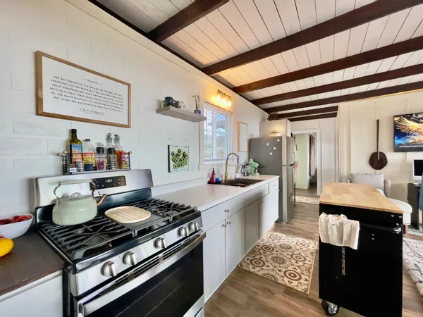 a kitchen with a stove and cabinets