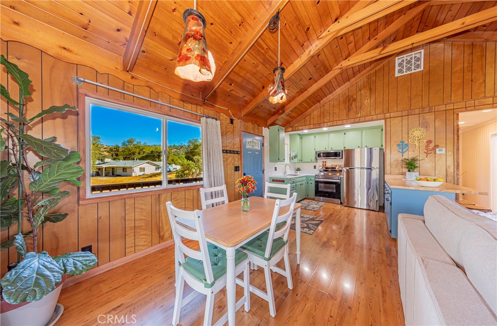 43629 Ranger Cir Drive Coarsegold, CA 93614 - Photo 14 of 54 a view of a patio with table and chairs potted plants with wooden floor and fence