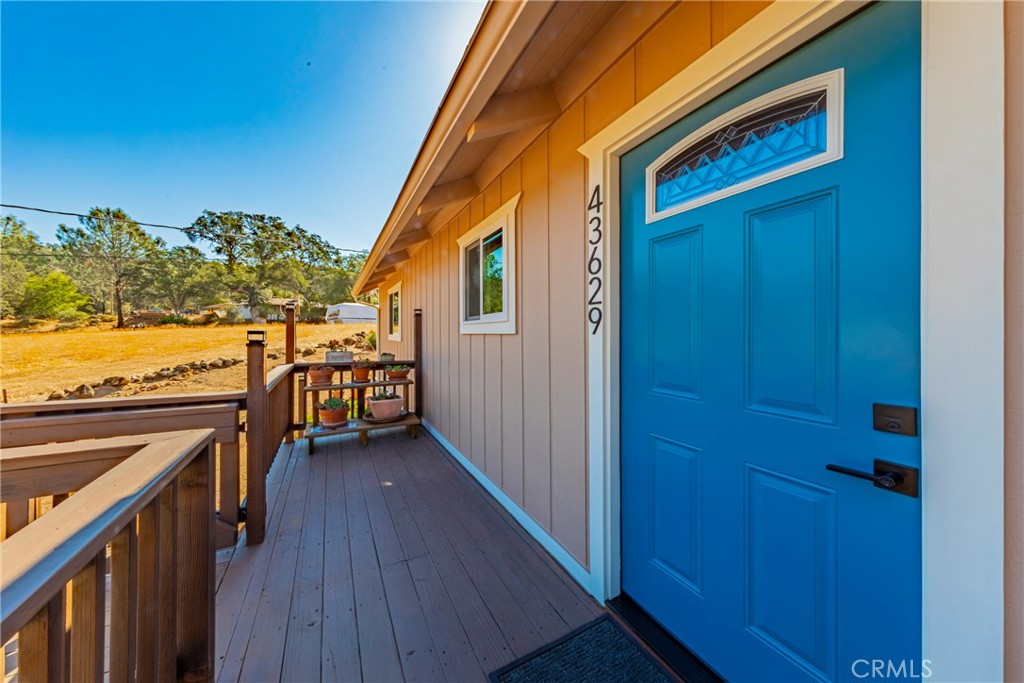 43629 Ranger Cir Drive Coarsegold, CA 93614 - Photo 30 of 54 a view of a balcony with furniture and wooden floor