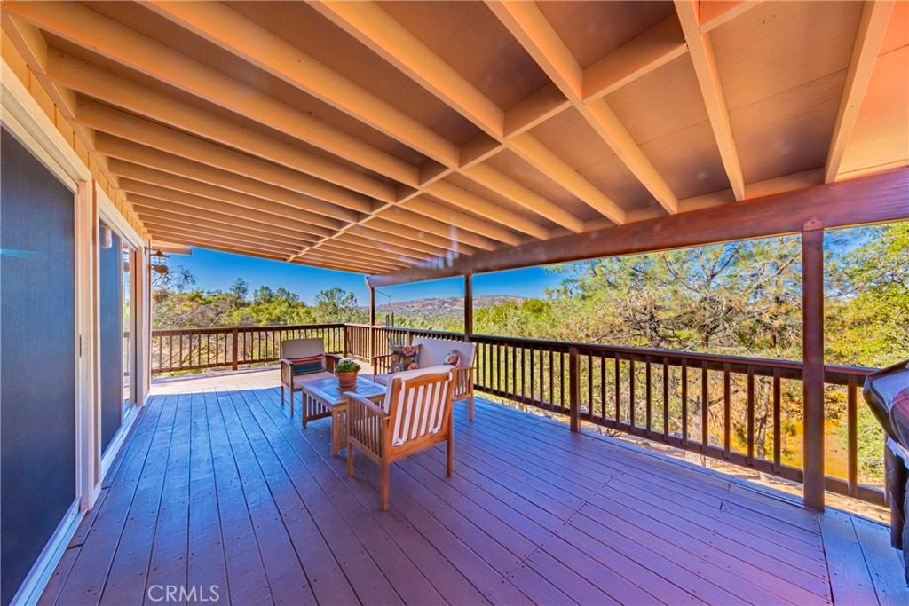 43629 Ranger Cir Drive Coarsegold, CA 93614 - Photo 4 of 54 a view of a patio with wooden floor chairs