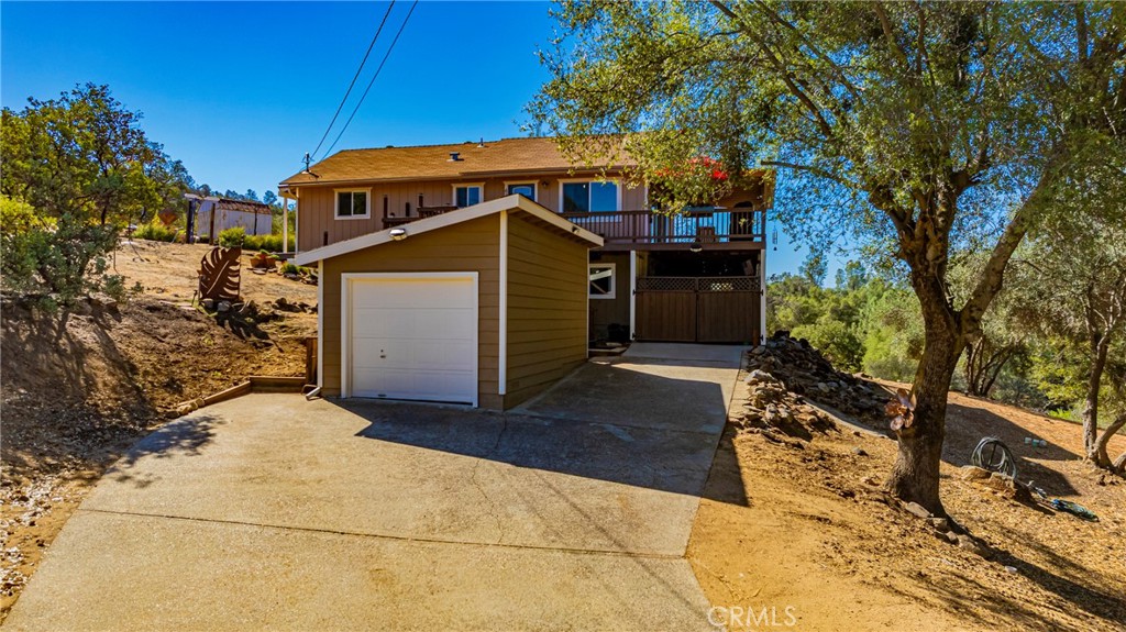 43629 Ranger Cir Drive Coarsegold, CA 93614 - Photo 50 of 54 a front view of a house with a yard