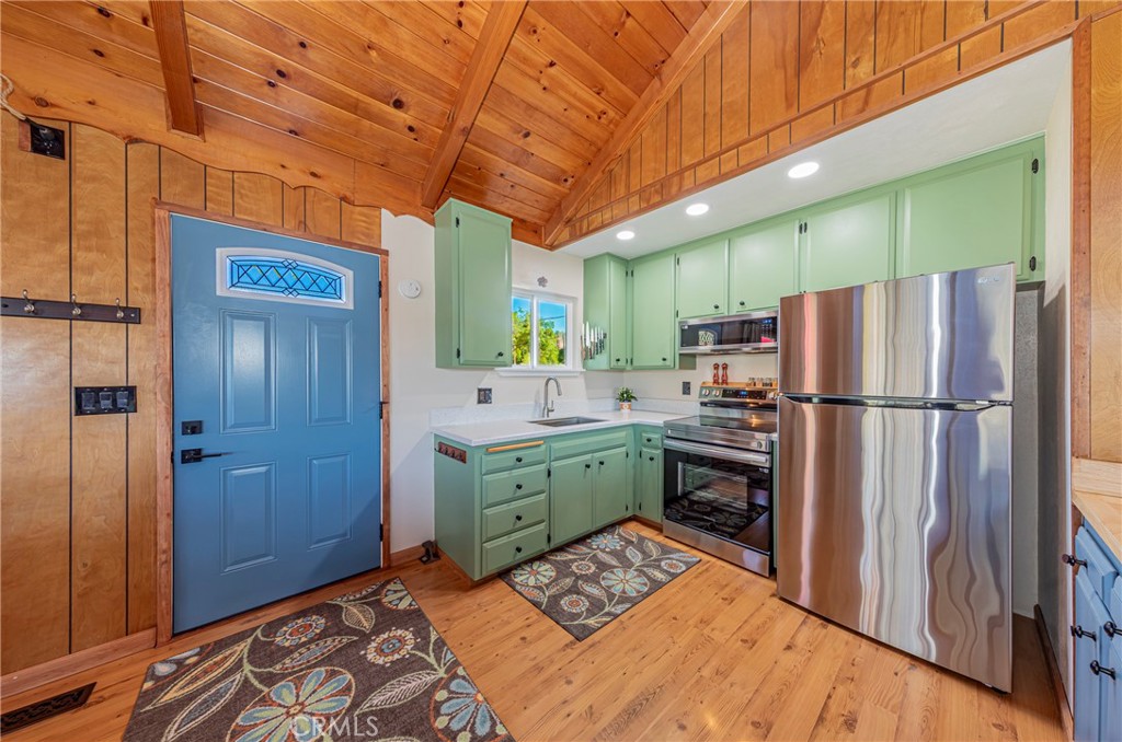 43629 Ranger Cir Drive Coarsegold, CA 93614 - Photo 8 of 54 a kitchen with a refrigerator and a sink