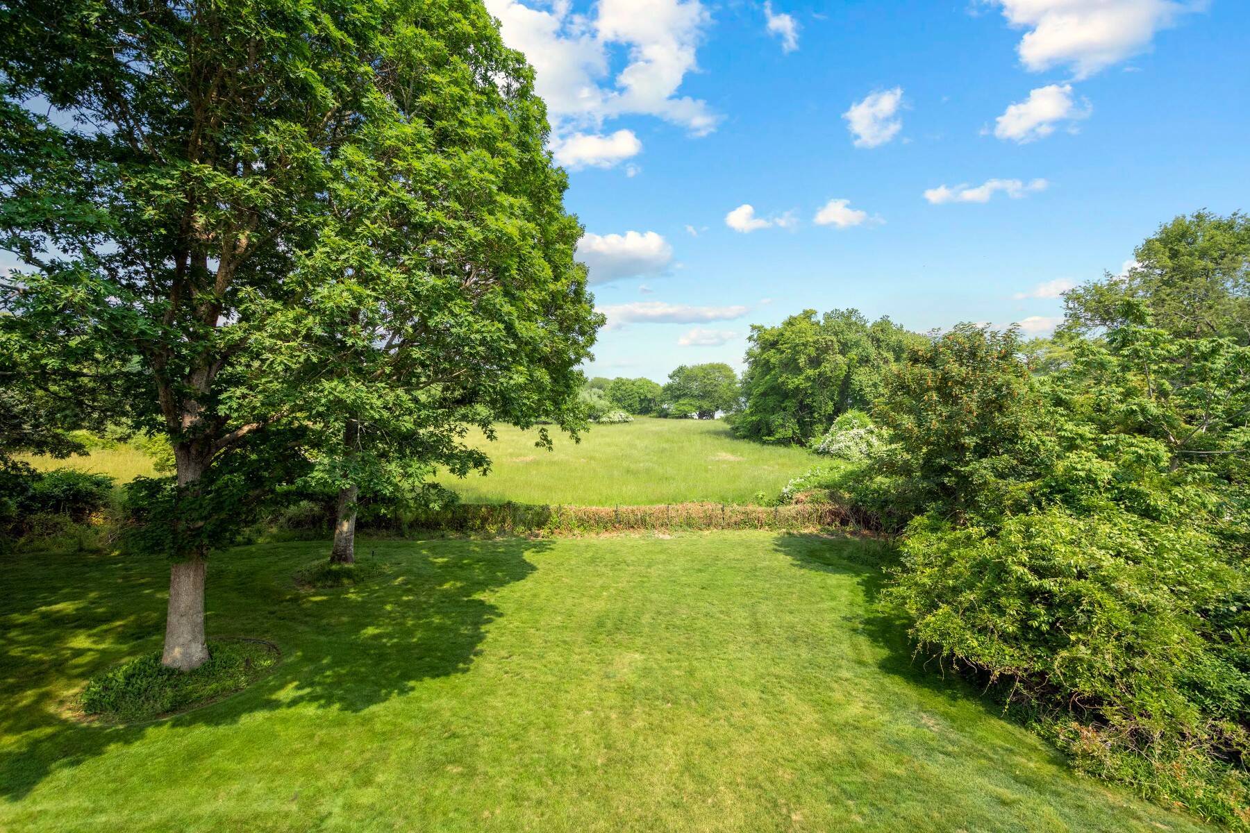 429 Head Of Pond Road Water Mill, NY 11976 - Photo 18 of 22 a view of an outdoor space and a yard