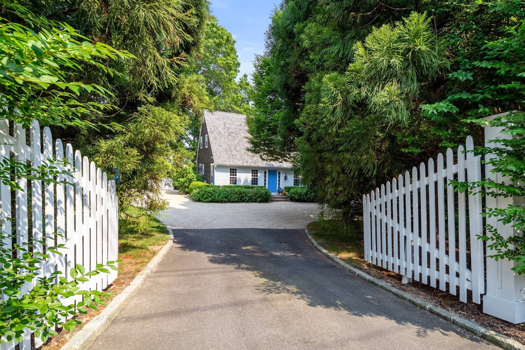 429 Head Of Pond Road Water Mill, NY 11976 - Photo 20 of 22 a view of a house with a small yard and large trees