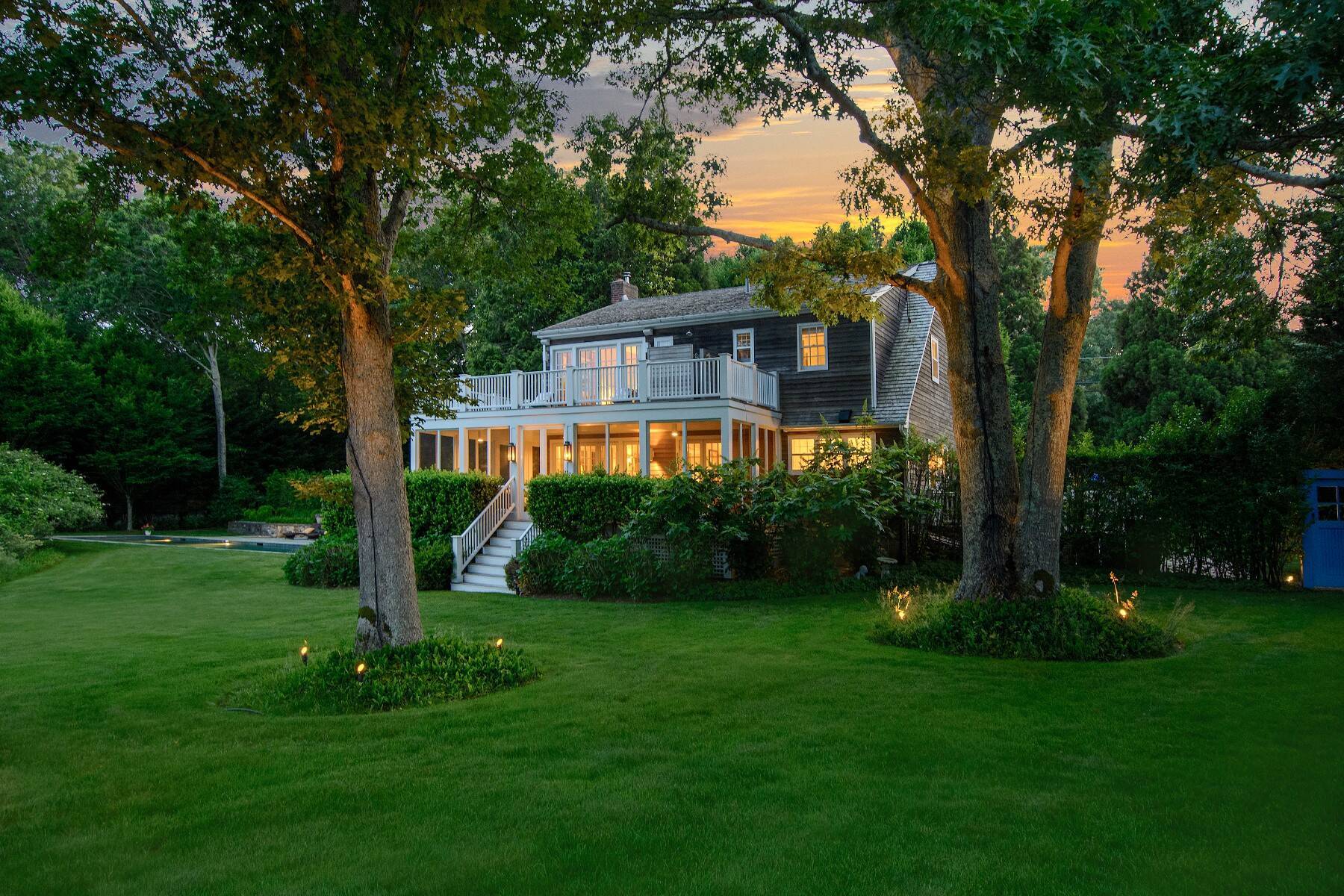 429 Head Of Pond Road Water Mill, NY 11976 - Photo 2 of 22 a front view of a house with a yard and a tree