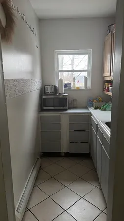 a kitchen with stainless steel appliances a cabinets and a refrigerator