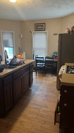 a kitchen with a sink and cabinets