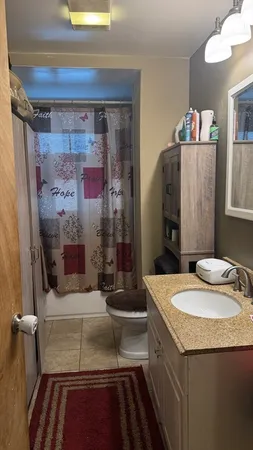a bathroom with sink and mirror