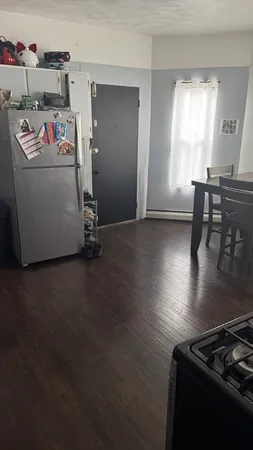 a room with furniture and a wooden floor