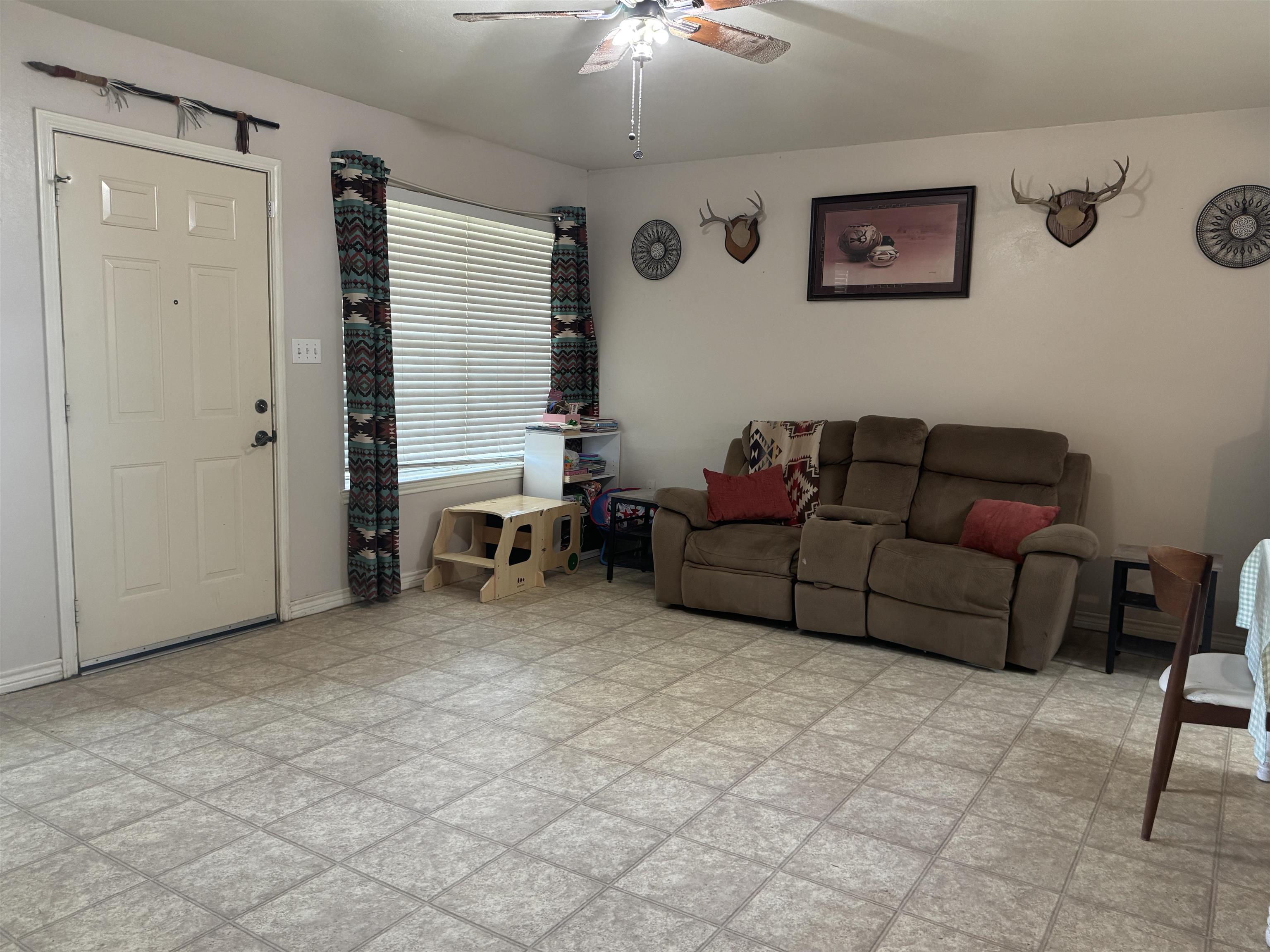 200 North 7th Street Lometa, TX 76853 - Photo 5 of 16 a living room with furniture and a dining table