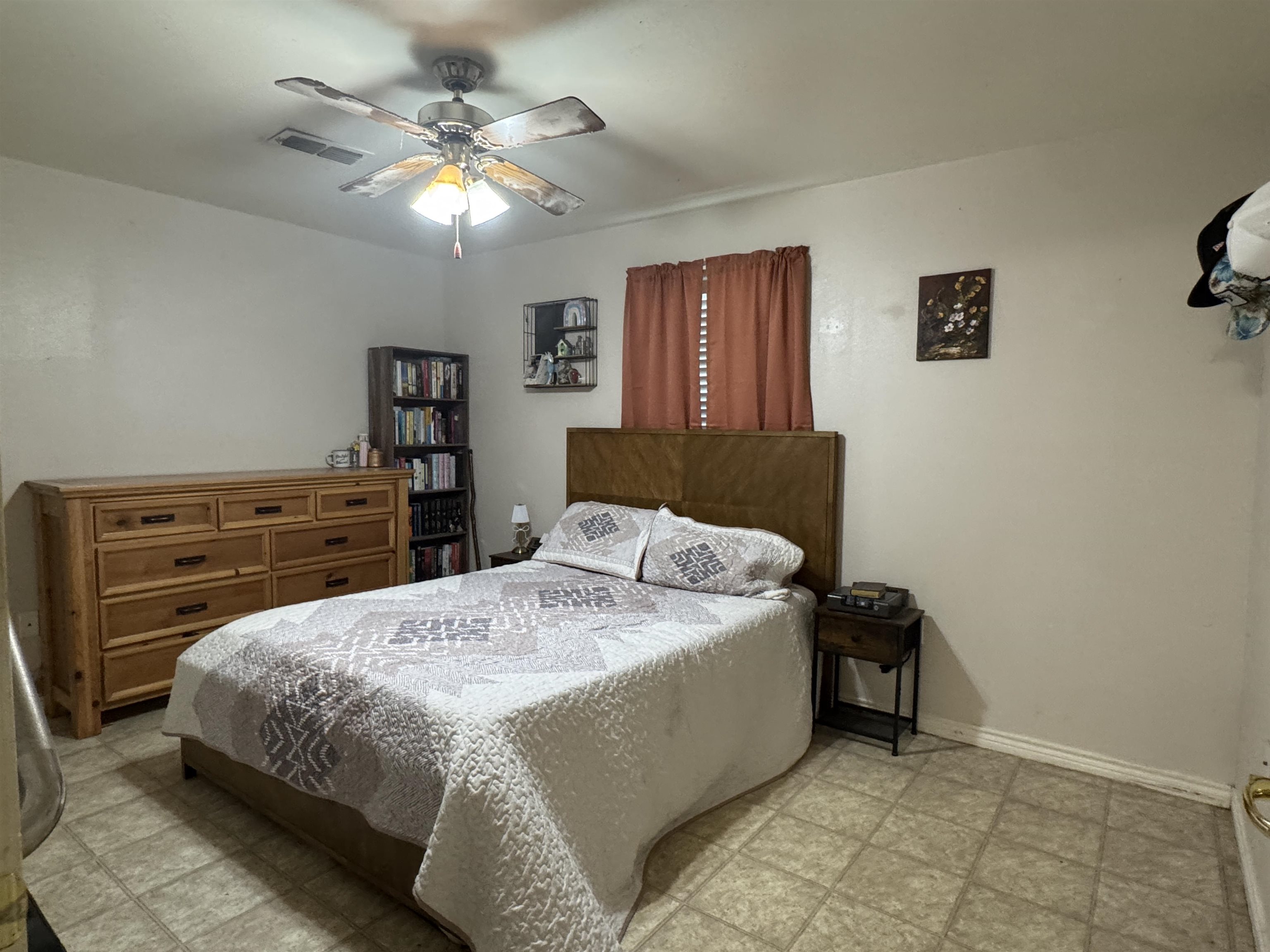 200 North 7th Street Lometa, TX 76853 - Photo 6 of 16 a bedroom with a bed and a ceiling fan