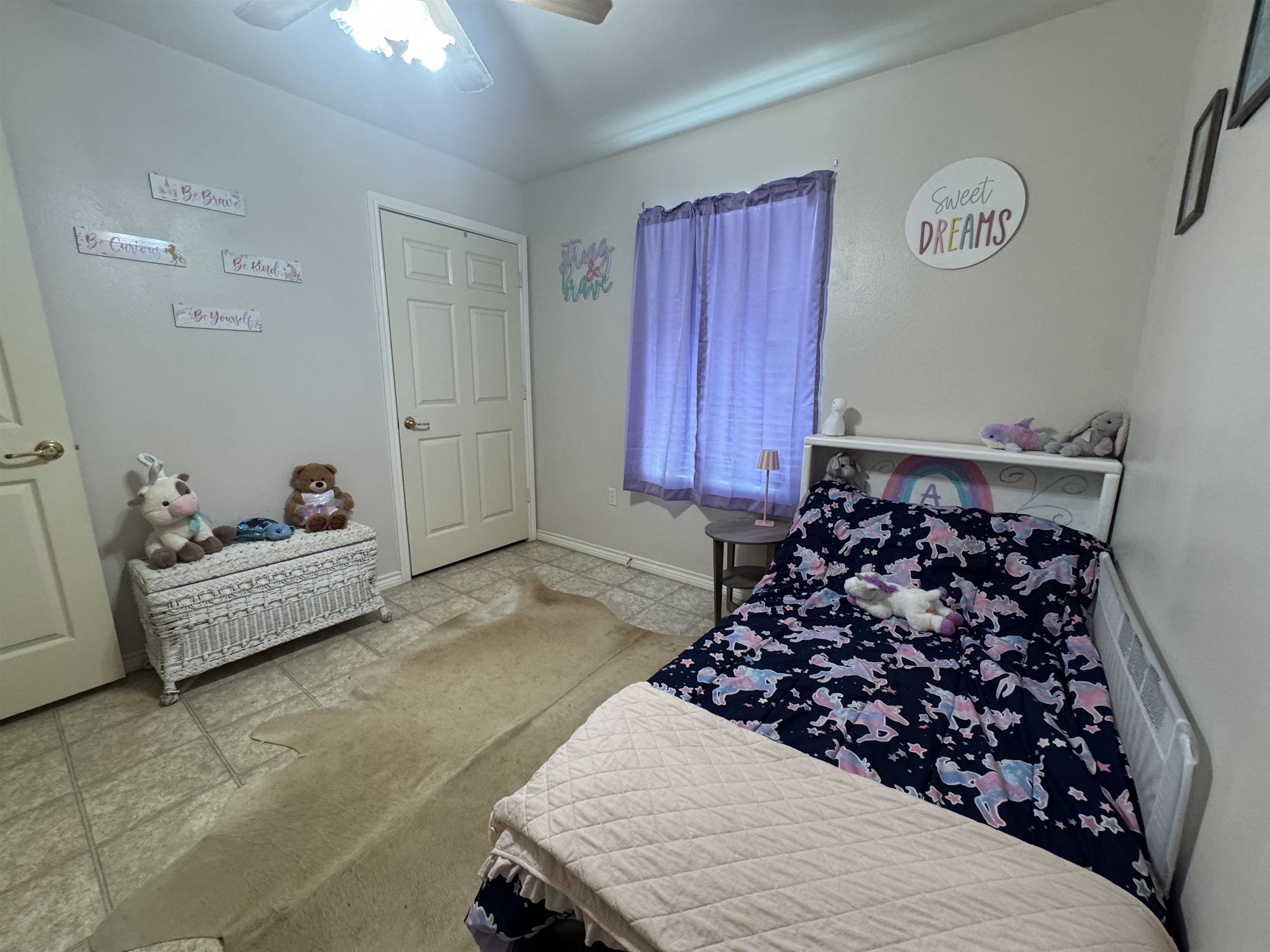 200 North 7th Street Lometa, TX 76853 - Photo 9 of 16 a bed room with a bed and a couch