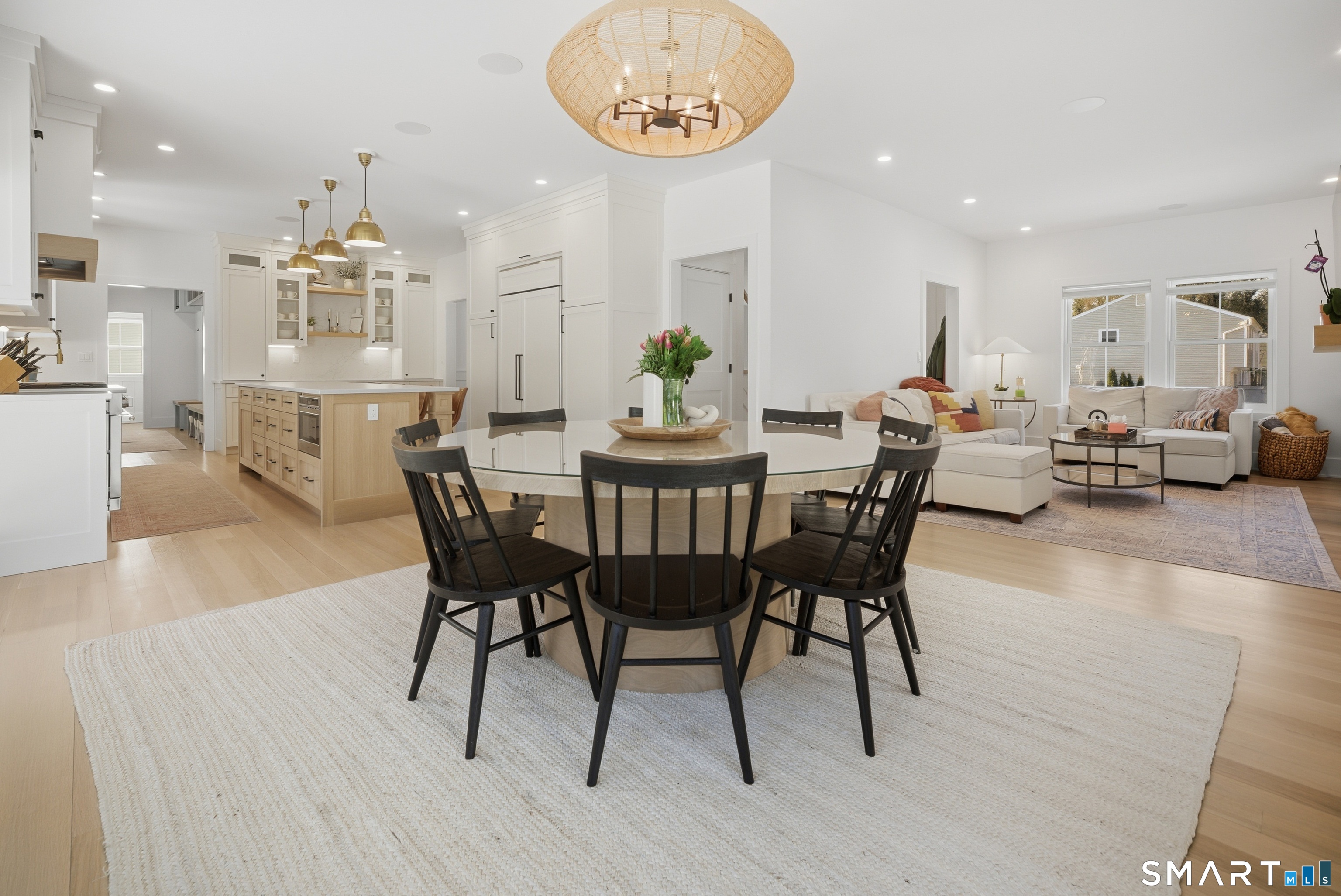 196 Robin Lane Fairfield, CT 06824 - Photo 17 of 37 a view of a dining room with furniture and wooden floor