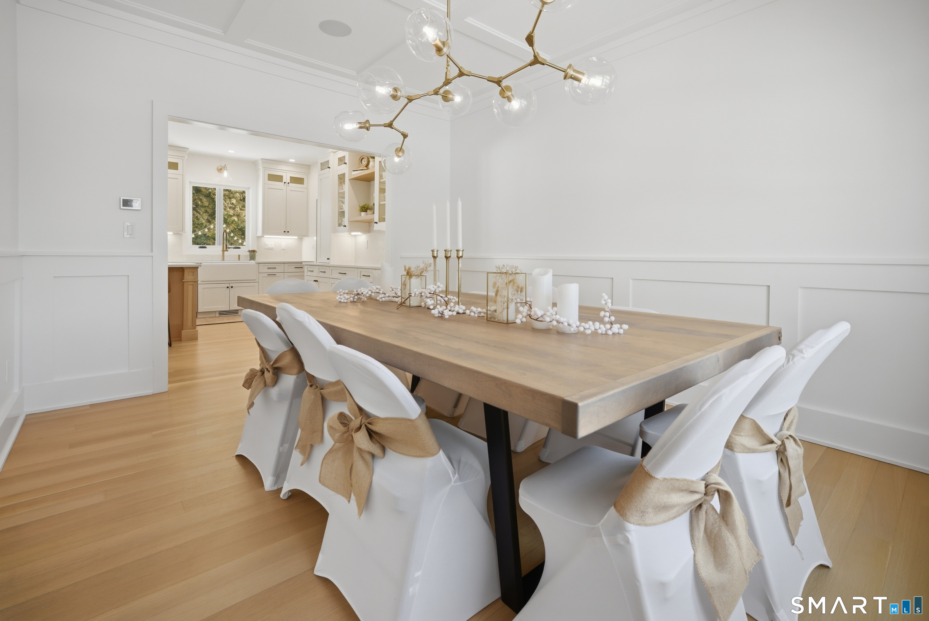 196 Robin Lane Fairfield, CT 06824 - Photo 24 of 37 a view of a dining room with furniture and wooden floor