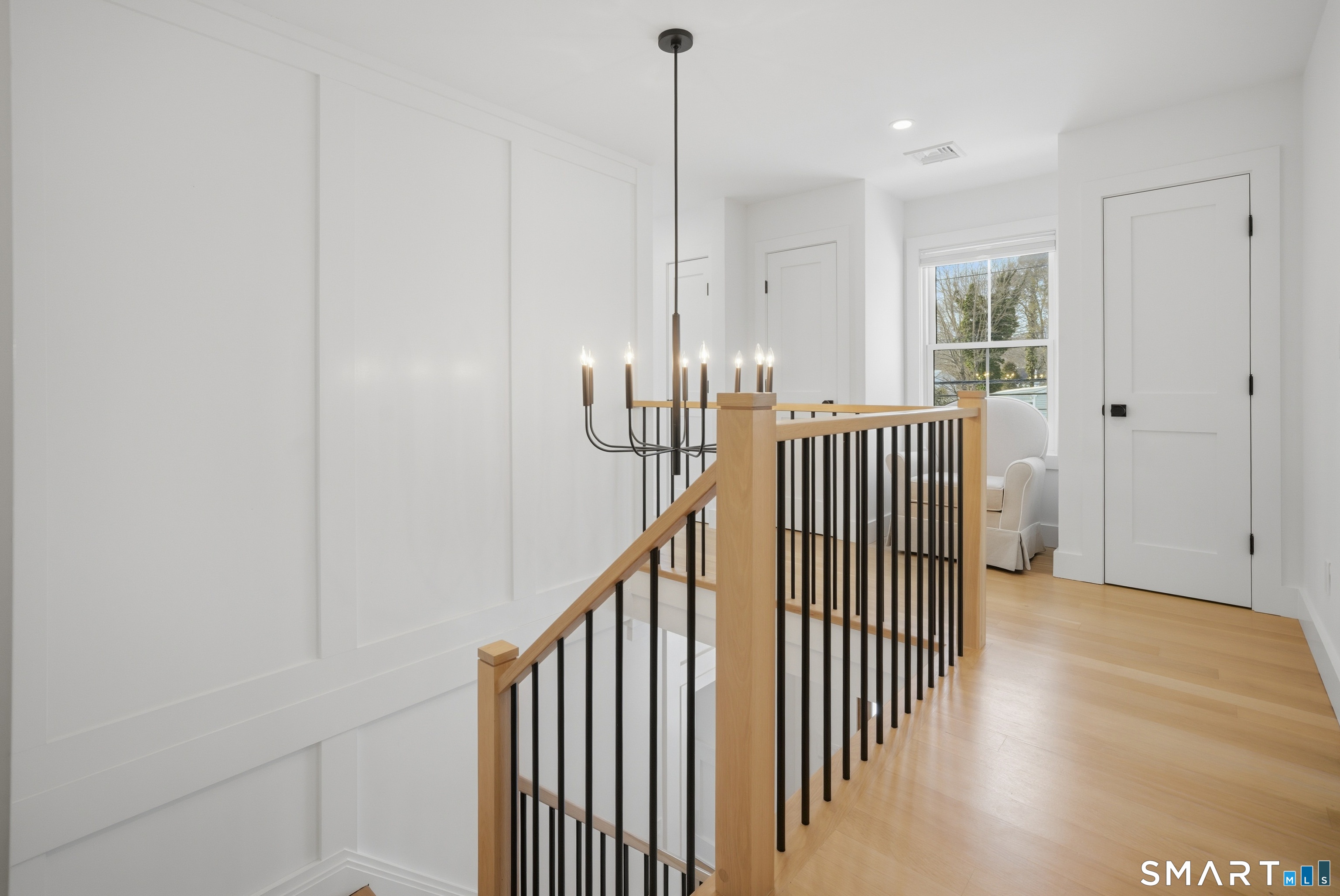 196 Robin Lane Fairfield, CT 06824 - Photo 26 of 37 a view of hallway with wooden floor