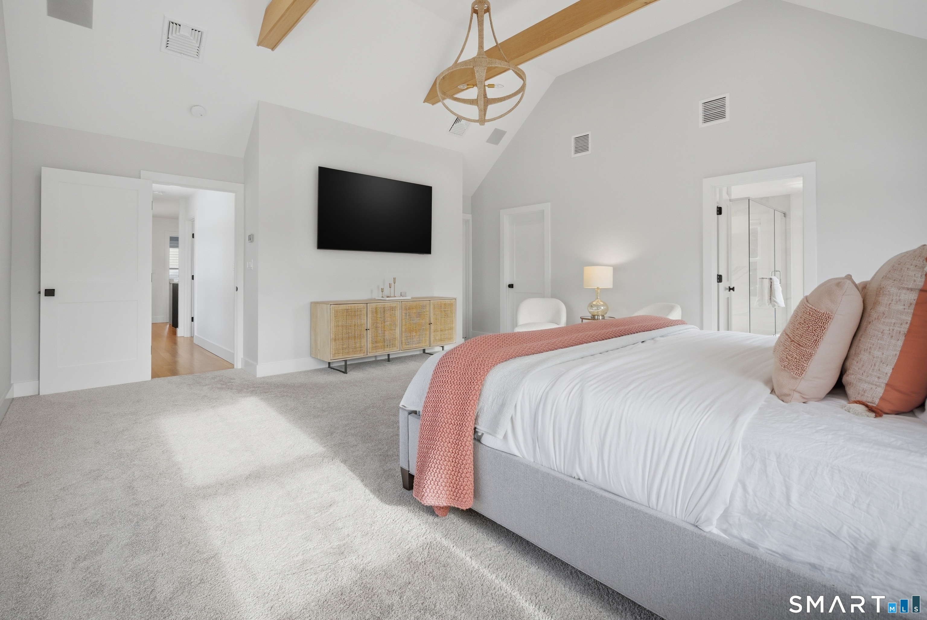 196 Robin Lane Fairfield, CT 06824 - Photo 28 of 37 a bedroom with a bed and a flat screen tv