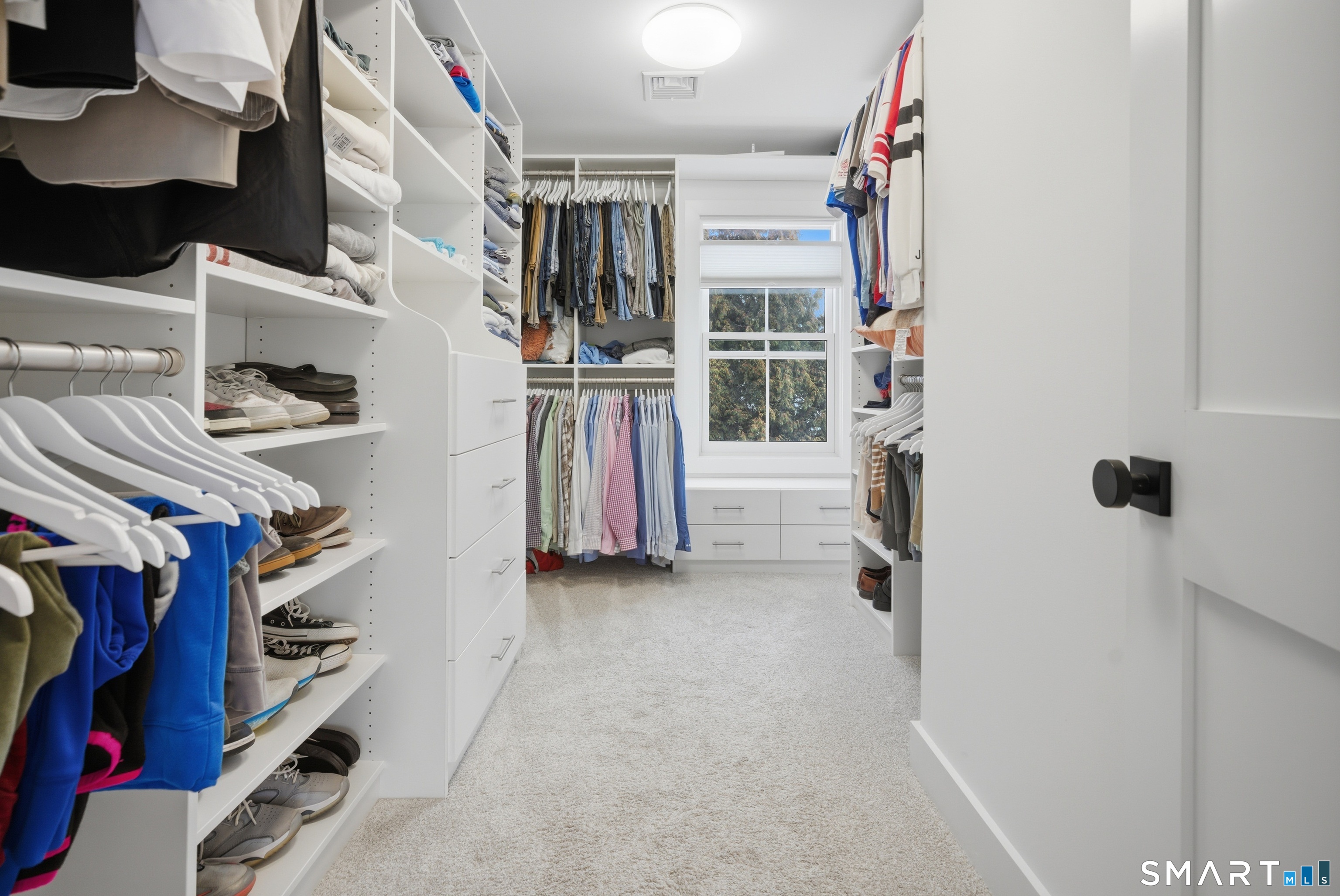 196 Robin Lane Fairfield, CT 06824 - Photo 3 of 37 a view of walk in closet with clothes and shoes
