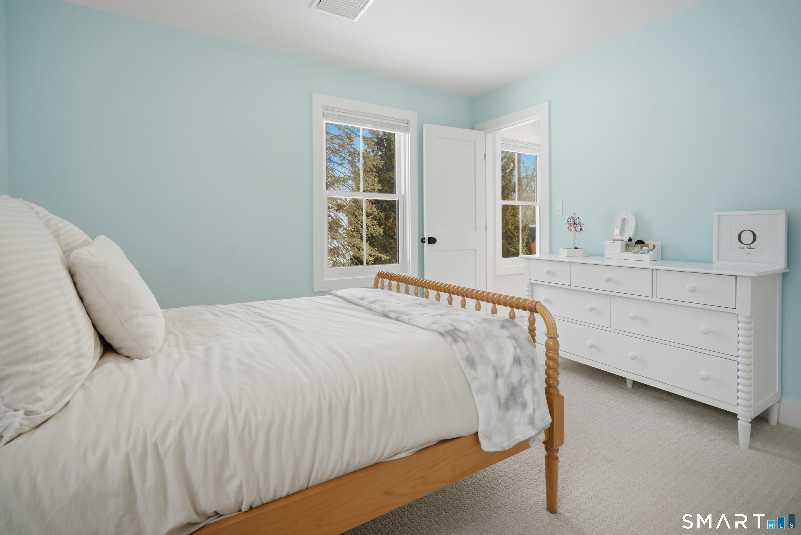 196 Robin Lane Fairfield, CT 06824 - Photo 8 of 37 a bedroom with a bed and window