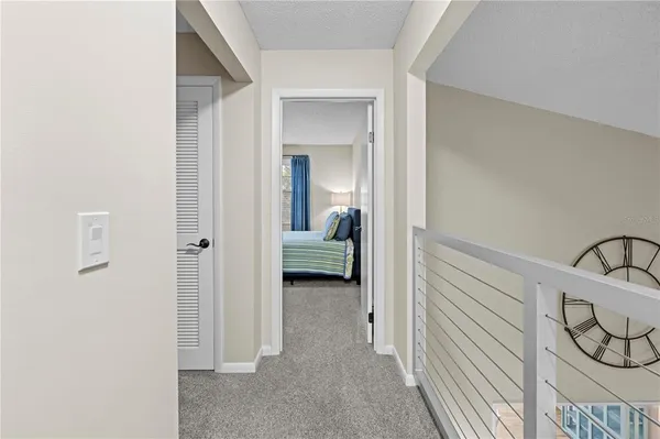 a view of a bedroom with furniture and window