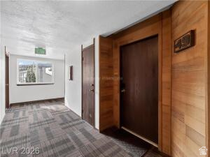 407 South Vasels Road, Unit 49 Brian Head, UT 84719 - Photo 5 of 40 Hall featuring dark colored carpet and wood walls