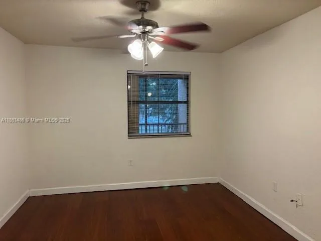 a kitchen with a refrigerator sink and cabinets