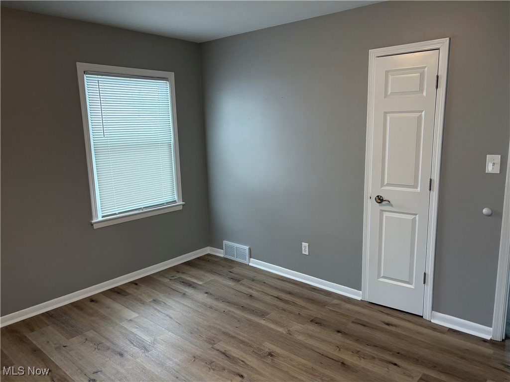 7817 Dalebrook Road Independence, OH 44131 - Photo 27 of 28 Spare room featuring wood-type flooring and plenty of natural light