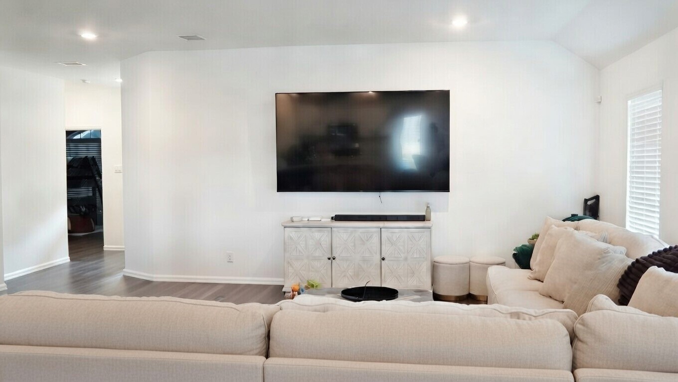 5307 Rushing Brk Lane Rosenberg, TX 77469 - Photo 4 of 8 a living room with furniture and a flat screen tv
