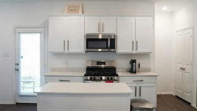 a kitchen with a sink and cabinets