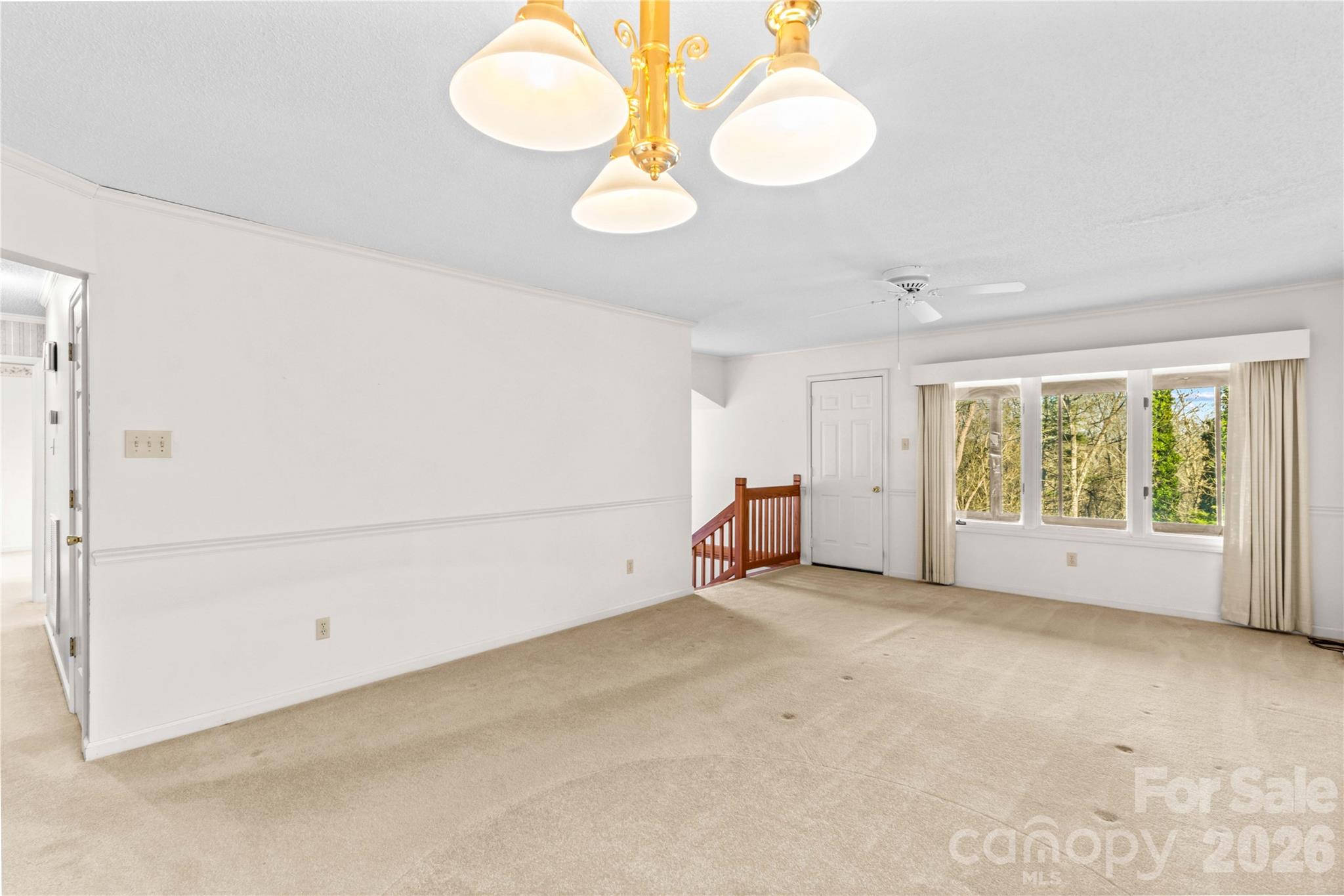 1336 Radio Road Statesville, NC 28625 - Photo 15 of 43 an empty room with windows and fan