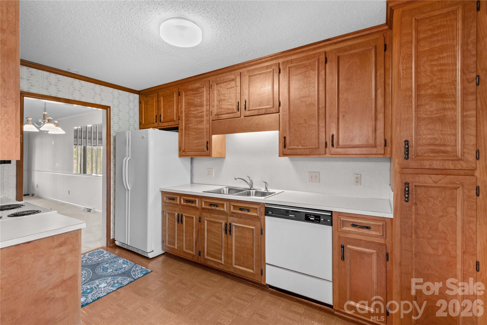 1336 Radio Road Statesville, NC 28625 - Photo 17 of 43 a kitchen with stainless steel appliances granite countertop a stove a sink and a refrigerator