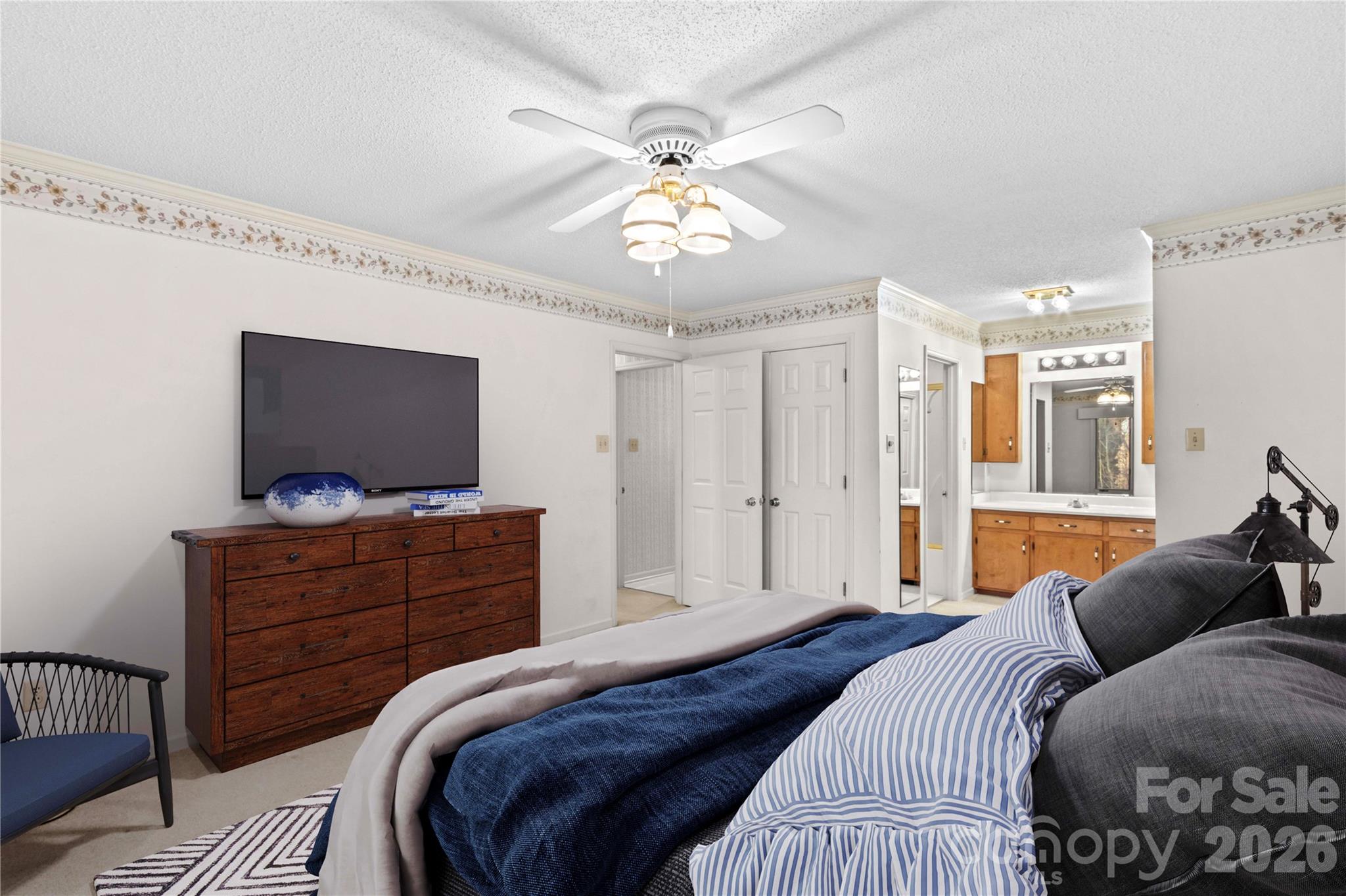1336 Radio Road Statesville, NC 28625 - Photo 31 of 43 a bedroom with a bed and a flat screen tv