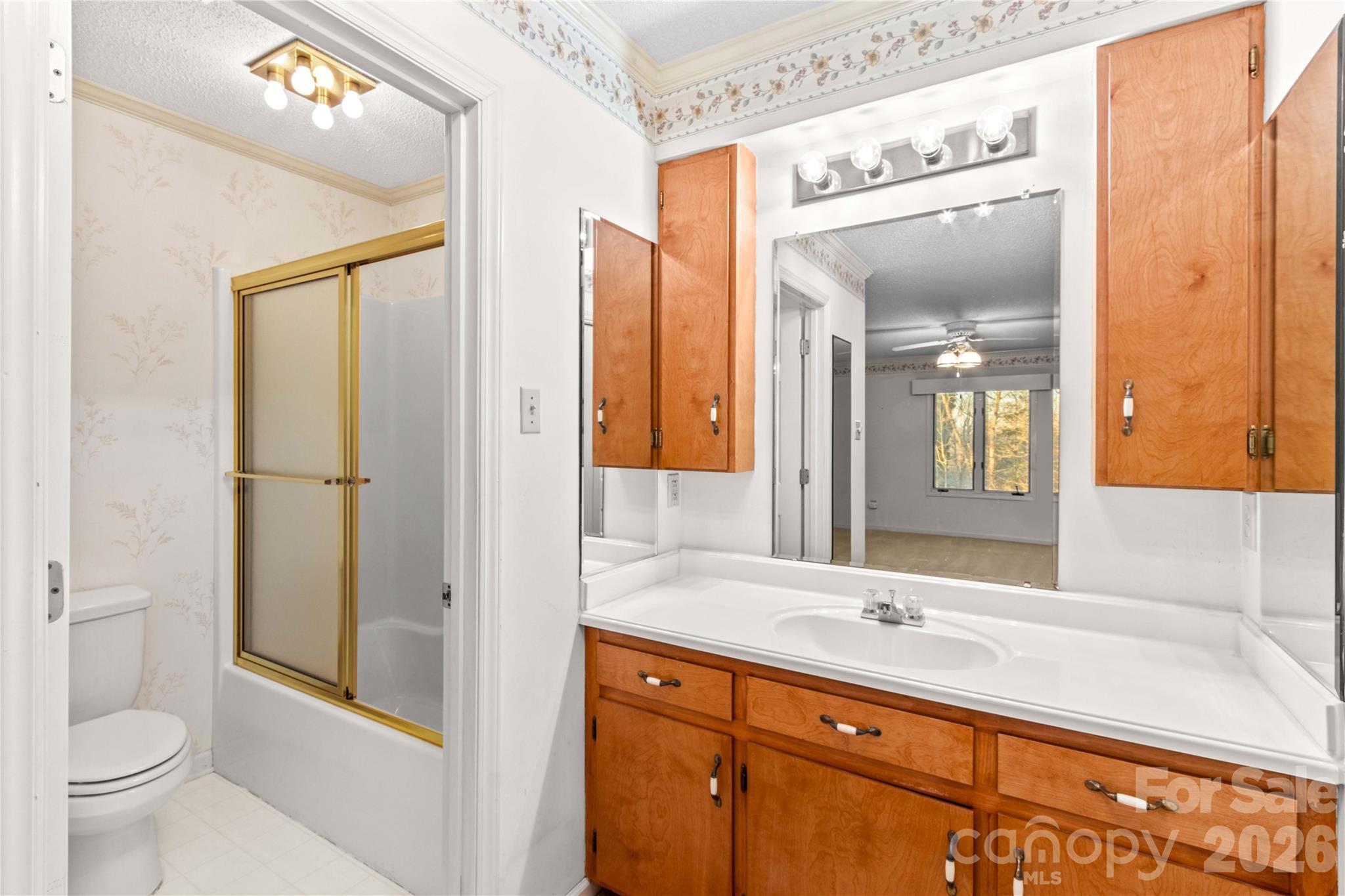 1336 Radio Road Statesville, NC 28625 - Photo 32 of 43 a bathroom with a sink a toilet and a large mirror