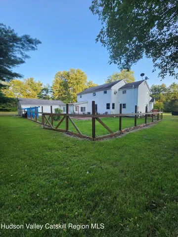 a view of backyard with green space