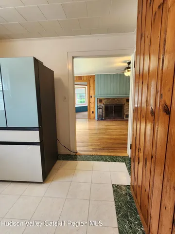 a view of a hallway with furniture