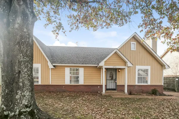 front view of a house with a yard