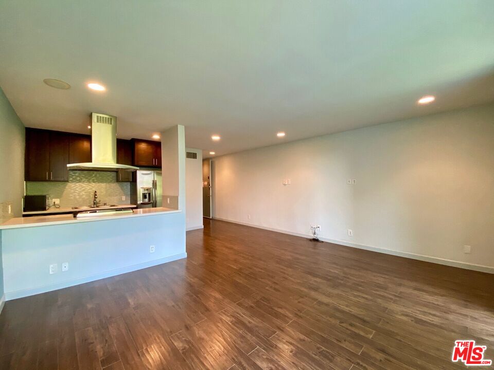 1920 Hillcrest Road, Unit 12 Los Angeles, CA 90068 - Photo 14 of 25 a view of kitchen with wooden floor