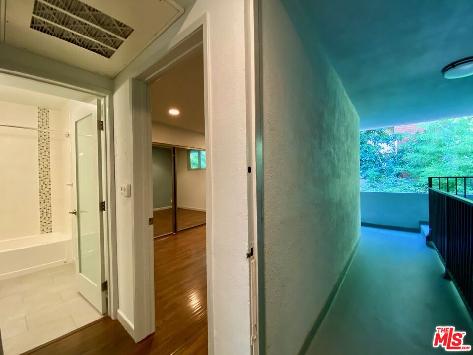 1920 Hillcrest Road, Unit 12 Los Angeles, CA 90068 - Photo 23 of 25 a view of hallway with a big room