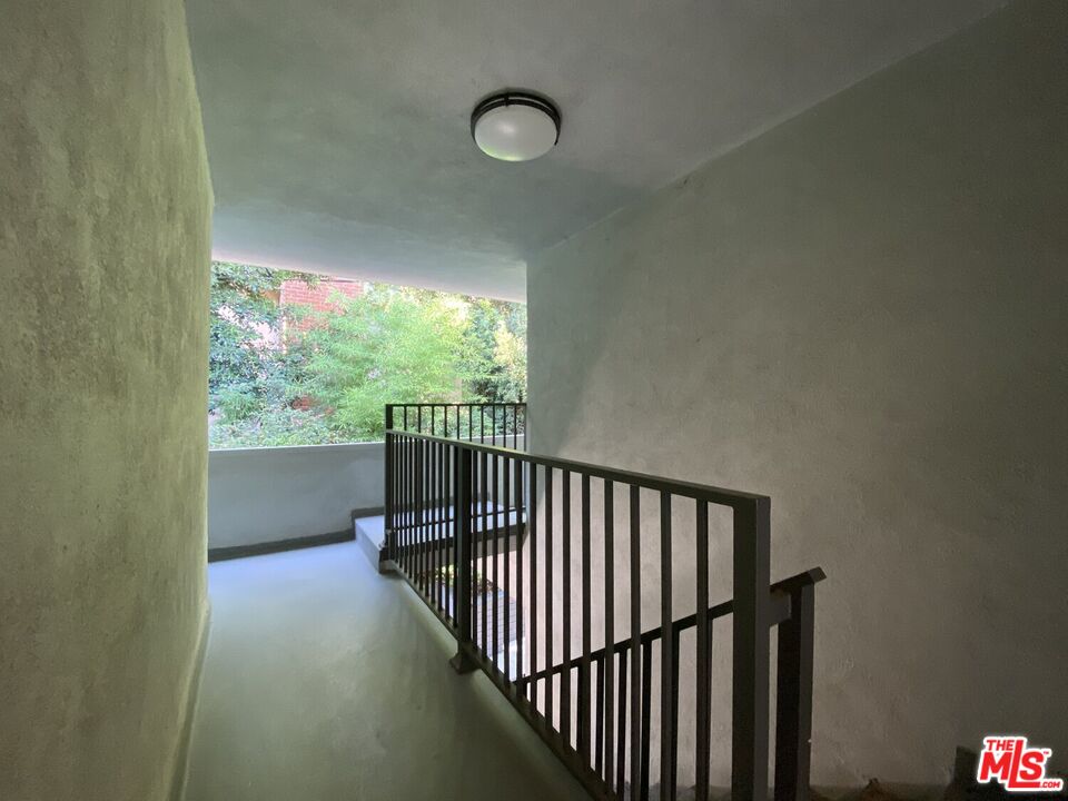 1920 Hillcrest Road, Unit 12 Los Angeles, CA 90068 - Photo 24 of 25 a view of hallway with stairs