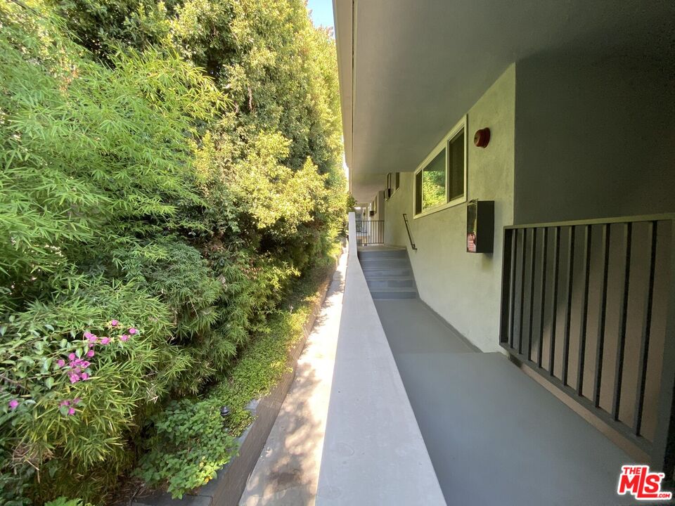 1920 Hillcrest Road, Unit 12 Los Angeles, CA 90068 - Photo 25 of 25 a view of a balcony with wooden floor