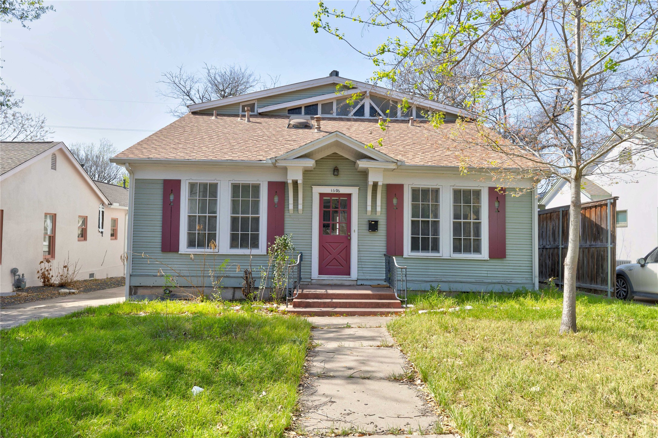 1606 Wethersfield Road Austin, TX 78703 - Photo 1 of 1 Bungalow-style home featuring fence and a front lawn