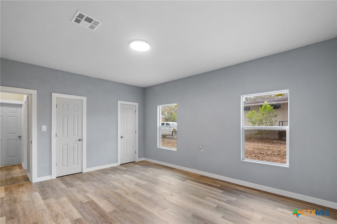 406 Hubbard Street Yoakum, TX 77995 - Photo 28 of 37 a view of an empty room with window and closet area