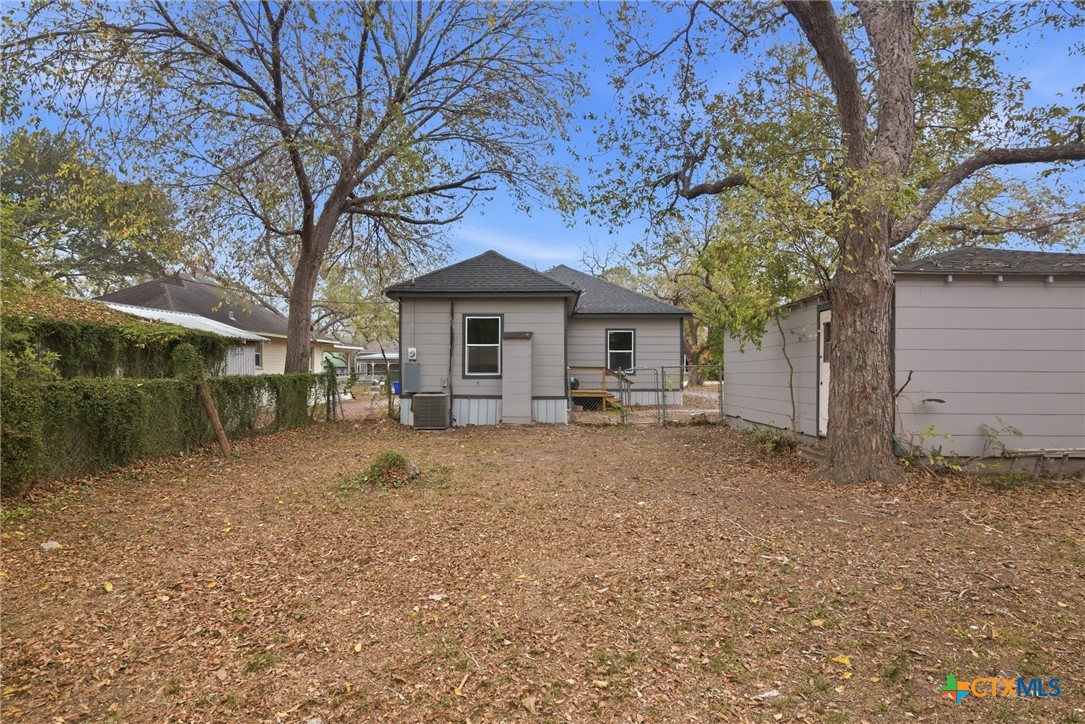 406 Hubbard Street Yoakum, TX 77995 - Photo 32 of 37 a front view of a house with a yard and garage