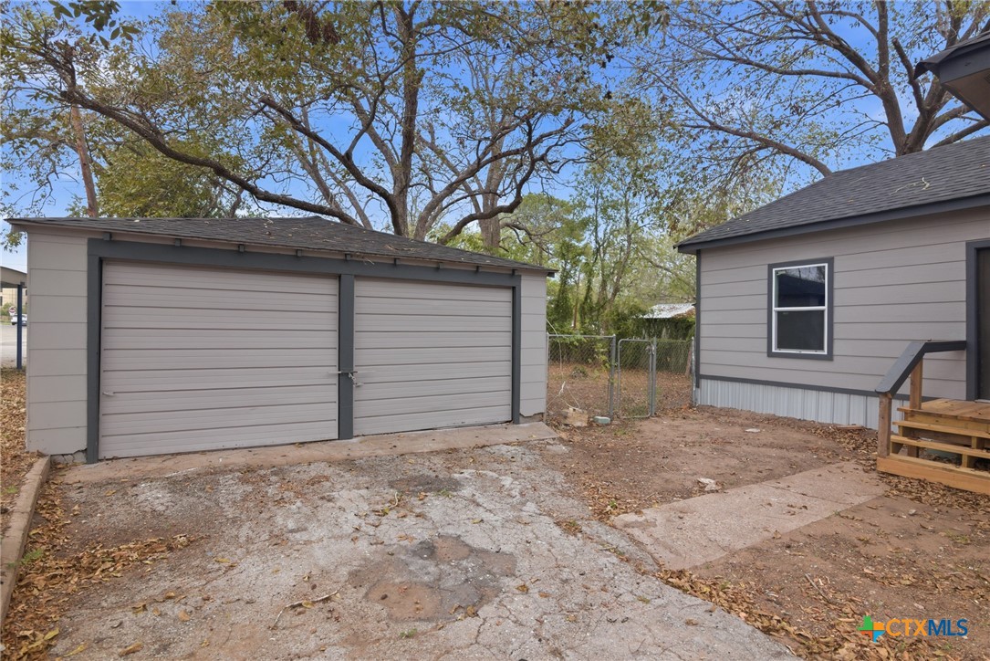406 Hubbard Street Yoakum, TX 77995 - Photo 34 of 37 a view of backyard with large tree