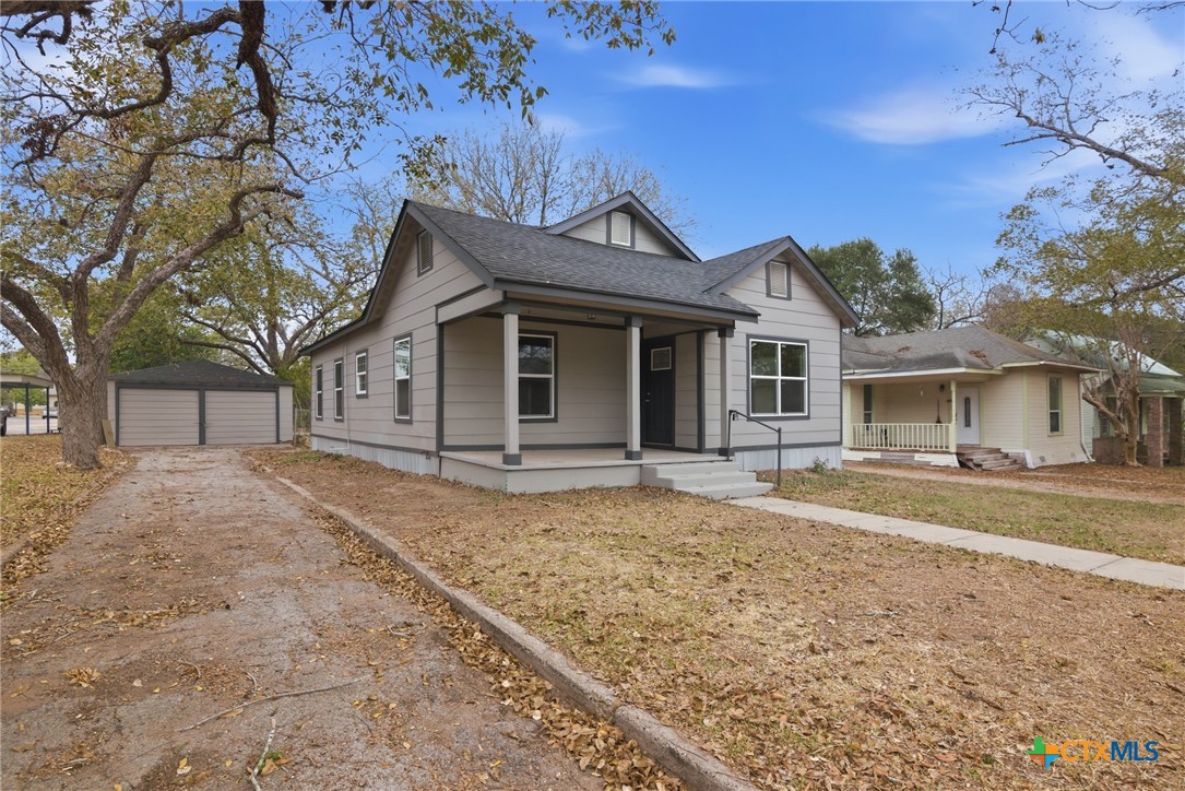 406 Hubbard Street Yoakum, TX 77995 - Photo 36 of 37 a view of a house with a yard and large tree