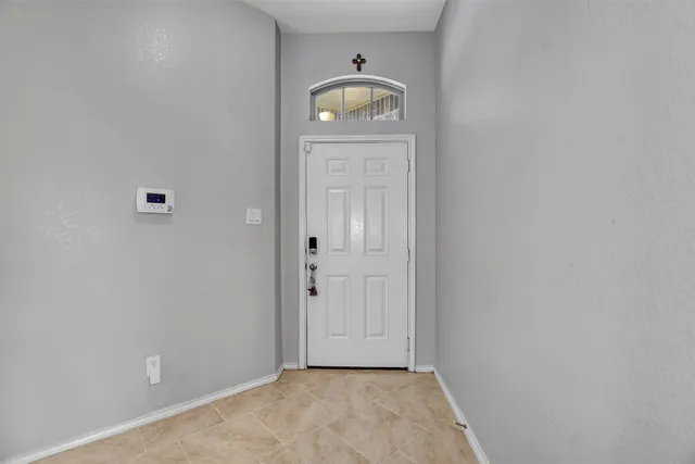 a large white kitchen with a refrigerator a stove a sink dishwasher a oven with wooden cabinets