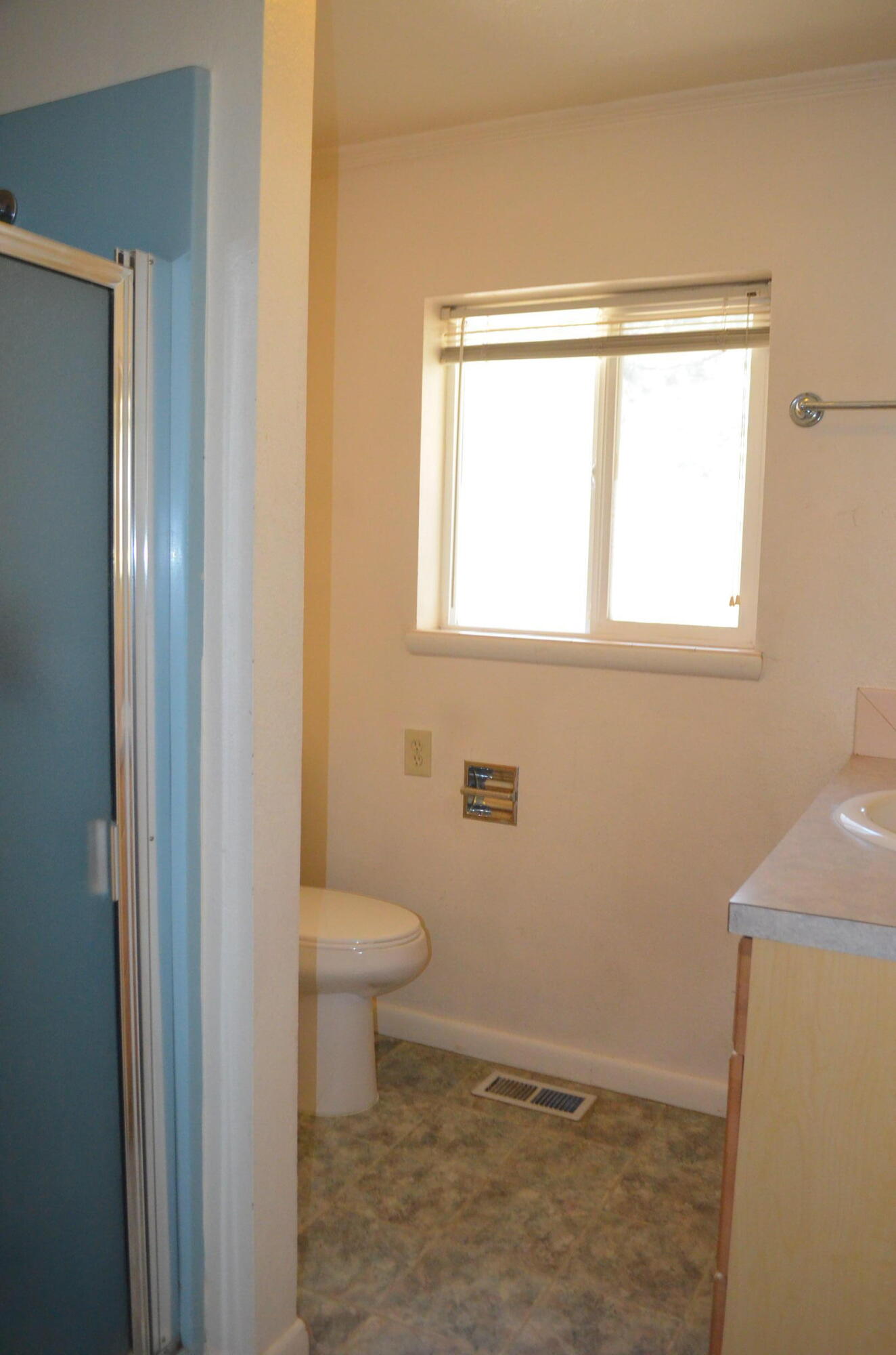 137008 Main Street Crescent, OR 97733 - Photo 33 of 50 a bathroom with a toilet sink and window